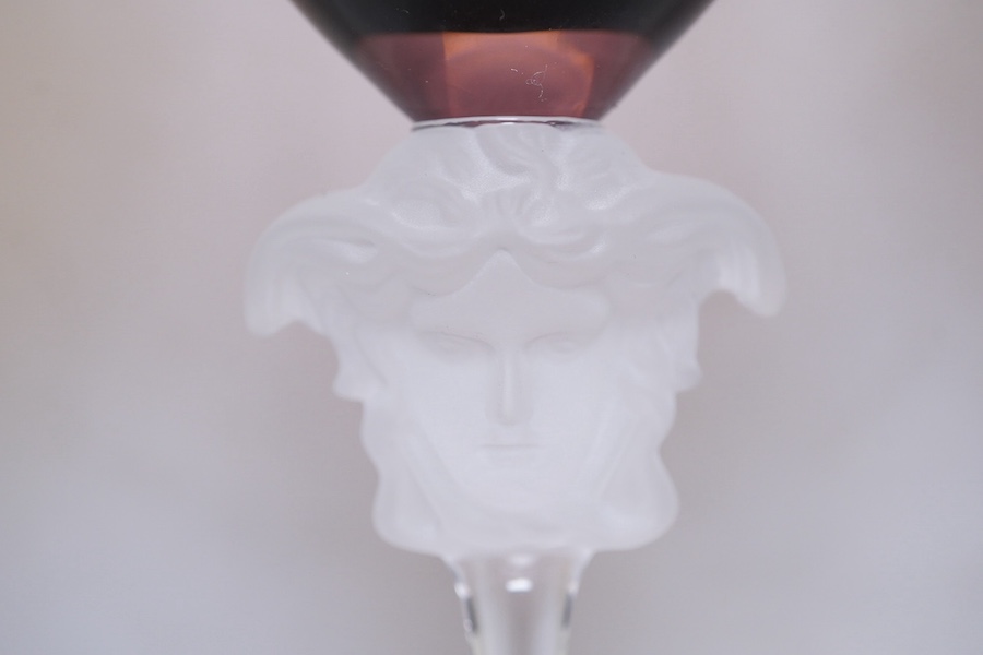 Four boxed Rosenthal for Versace Medusa head wine glasses in various colours, 26cm high. Condition - good.